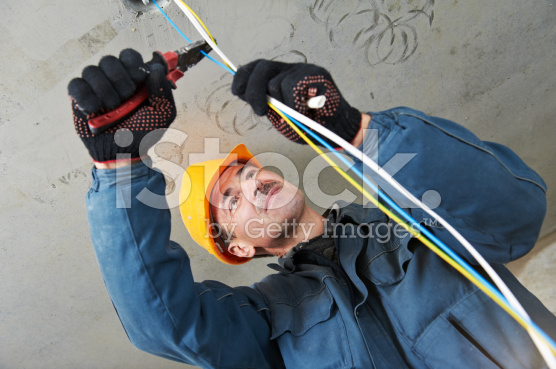 stock-photo-18279394-electrician-at-wiring-work